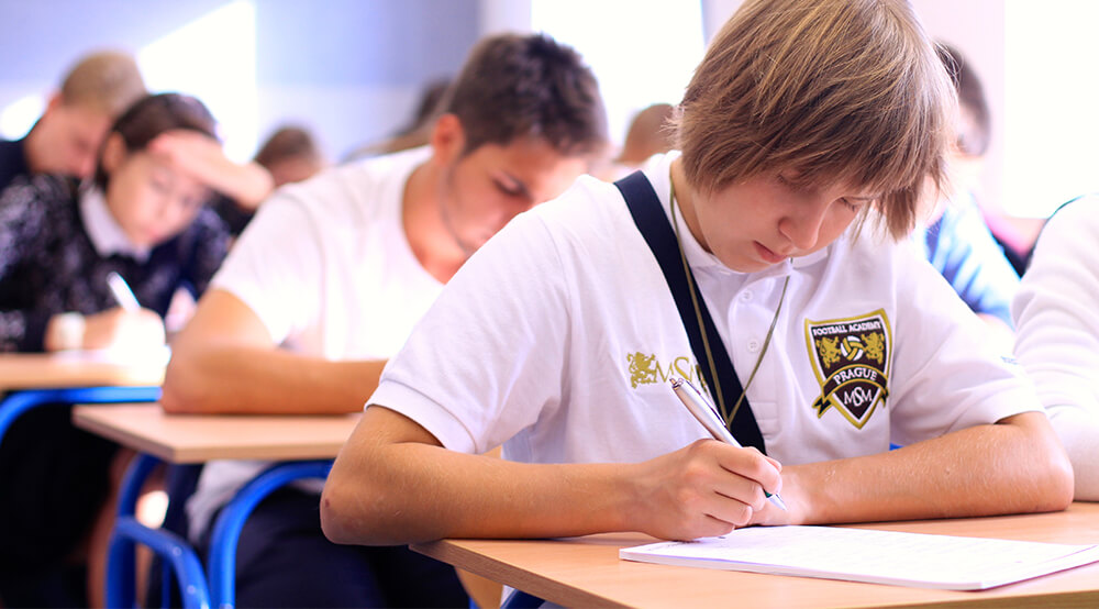 boy is taking an exam msmstudy.eu