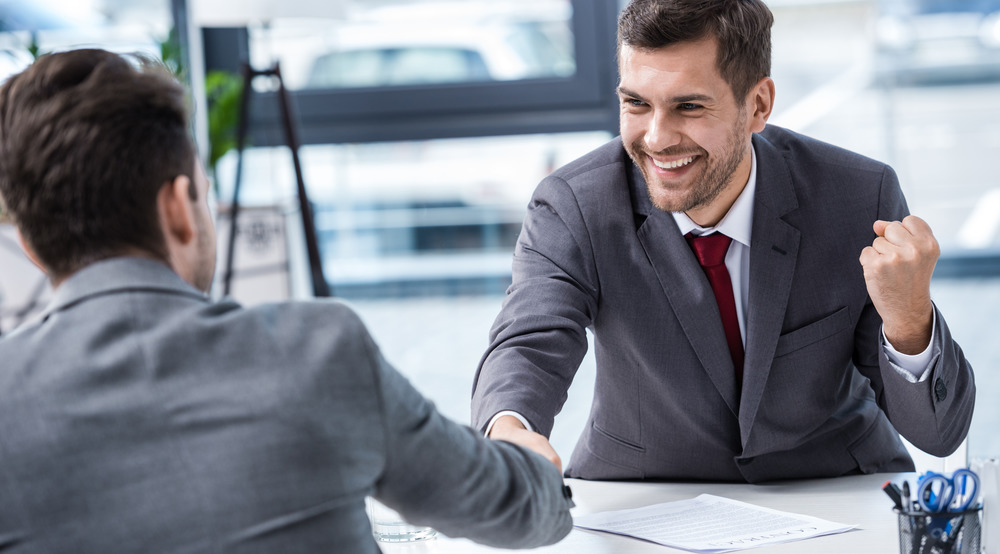 happy men in costumes handshake msmstudy.eu